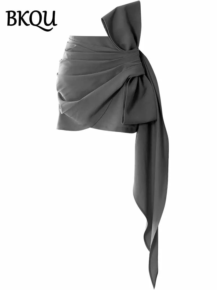 BKQU Asymmetric Pleated Bow Elegant Mini Skirt Women 2025 Spring Summer Fashion High Waist Slim Wrap Hip Short Skirt Party Wear