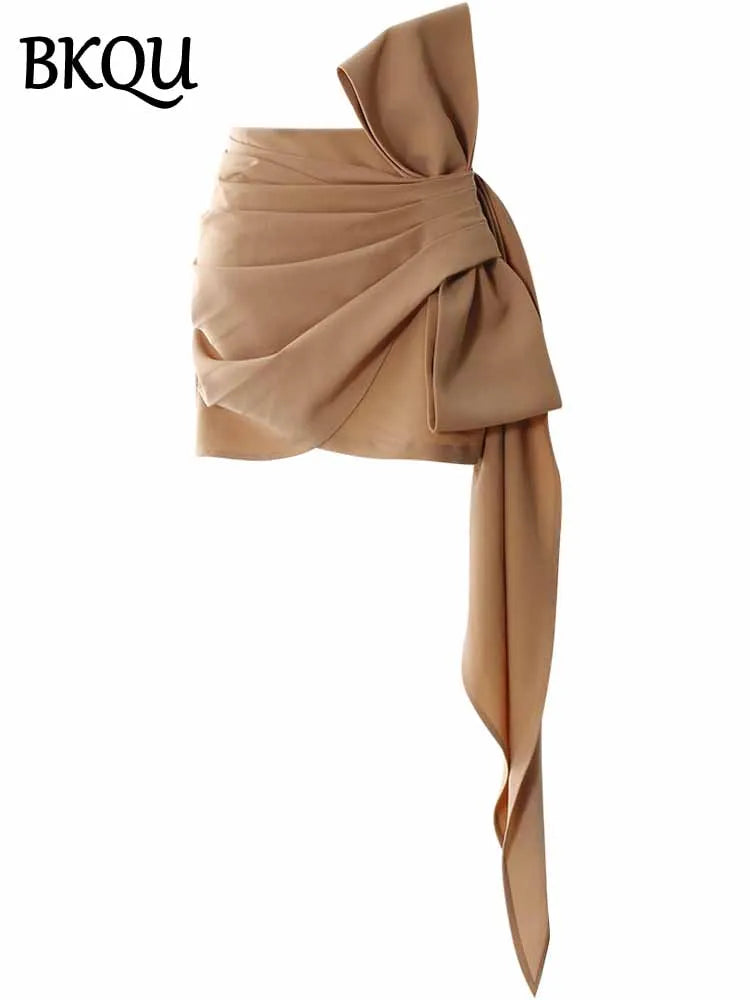 BKQU Asymmetric Pleated Bow Elegant Mini Skirt Women 2025 Spring Summer Fashion High Waist Slim Wrap Hip Short Skirt Party Wear